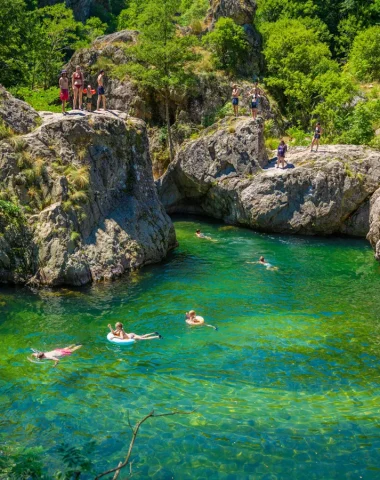 Swimming near the village with outstanding character of Jaujac, in summer