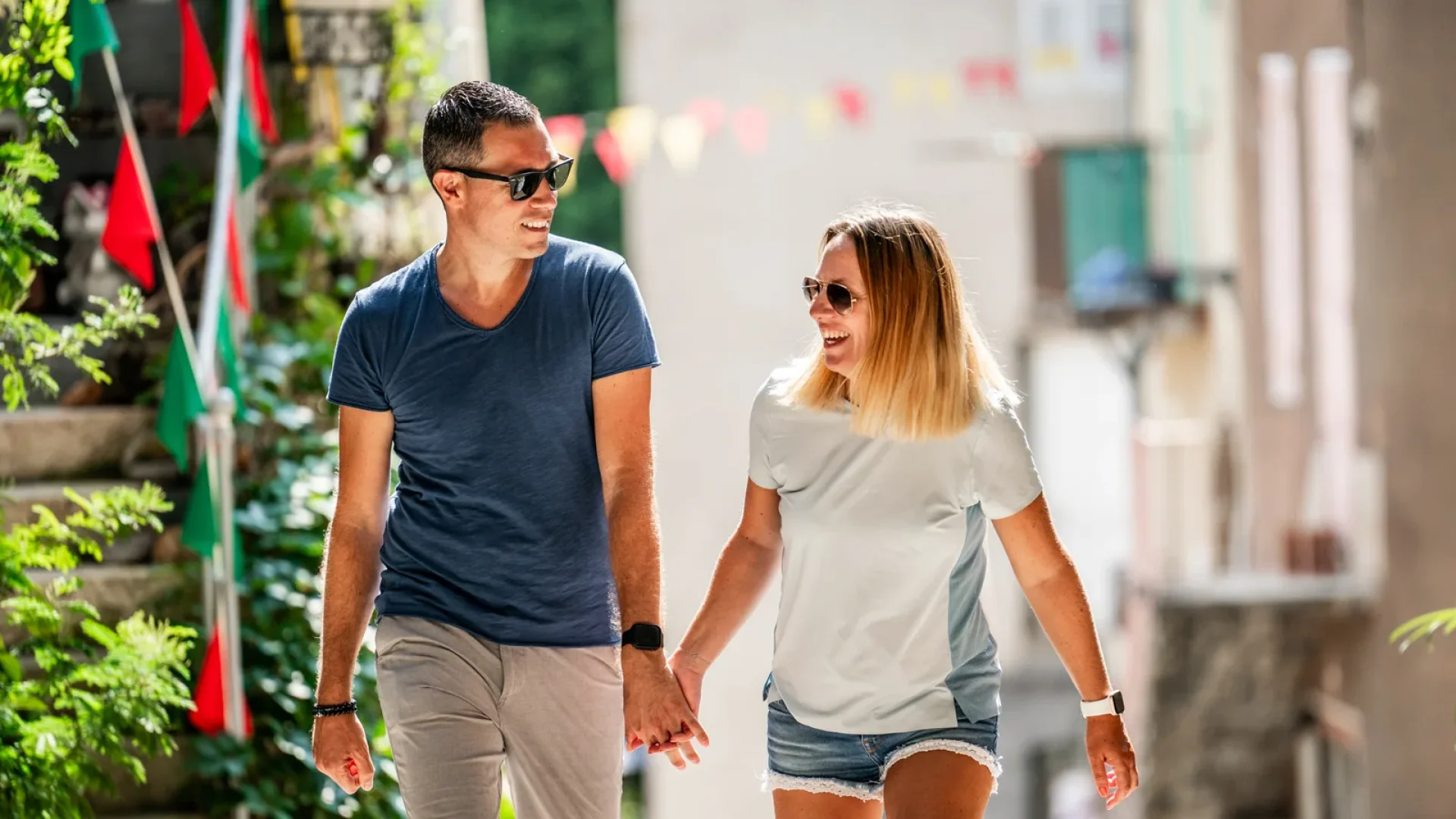 Couple wandering in the village with outstanding character of Beauchastel