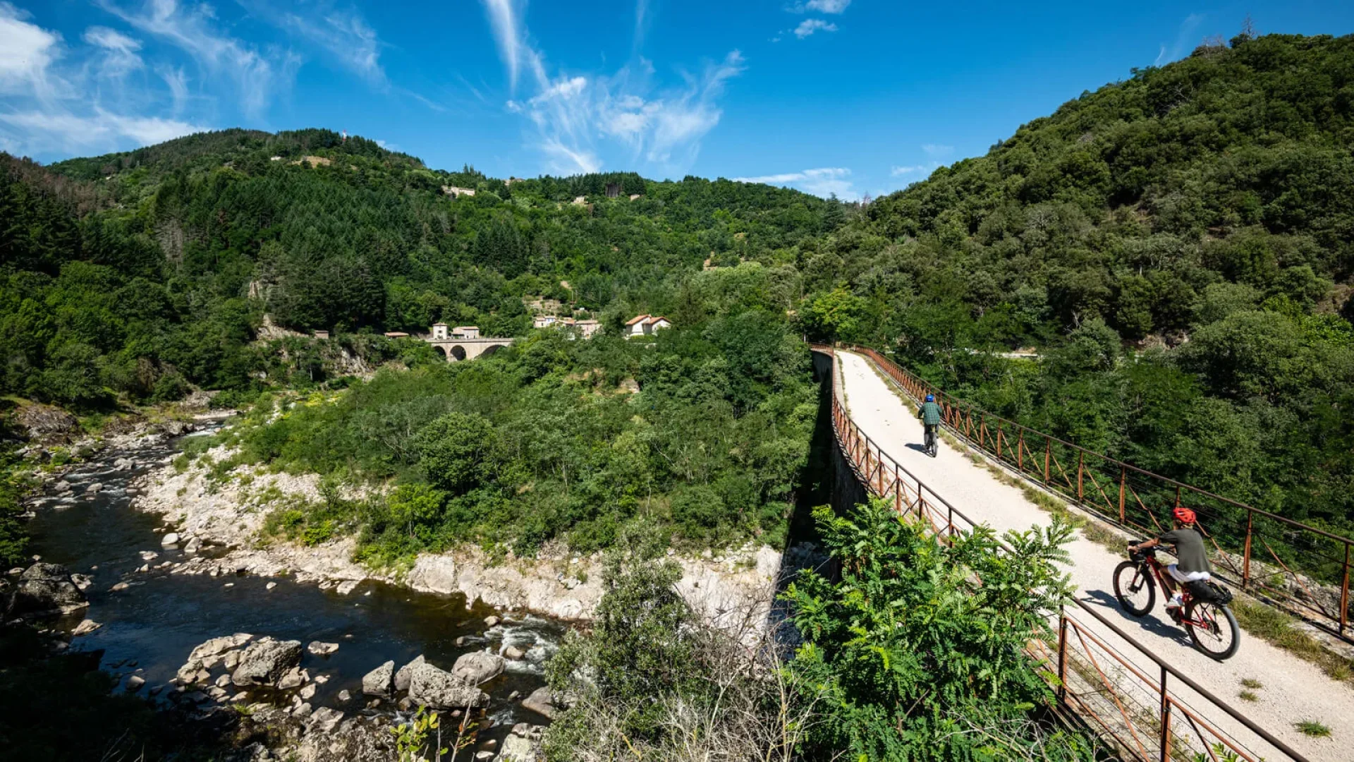 People cycling on the Dolce Via, in the Eyrieux valley, in summer