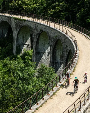 Family cycling on the Dolce Via, in the Eyrieux valley, in summer