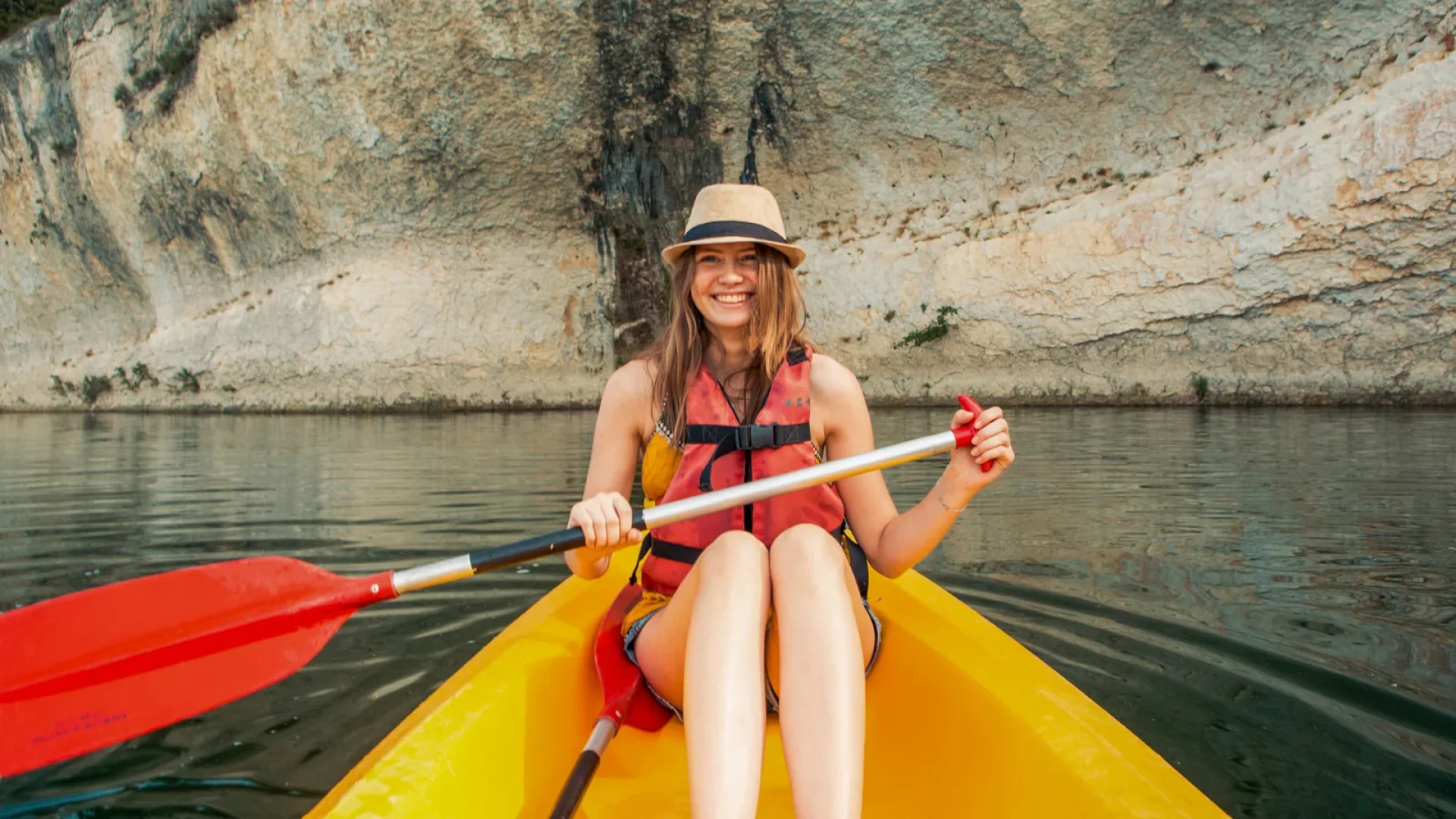 Woman in a canoe, in summer