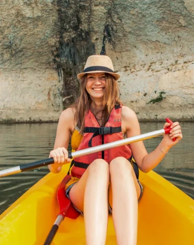 Woman in a canoe, in summer