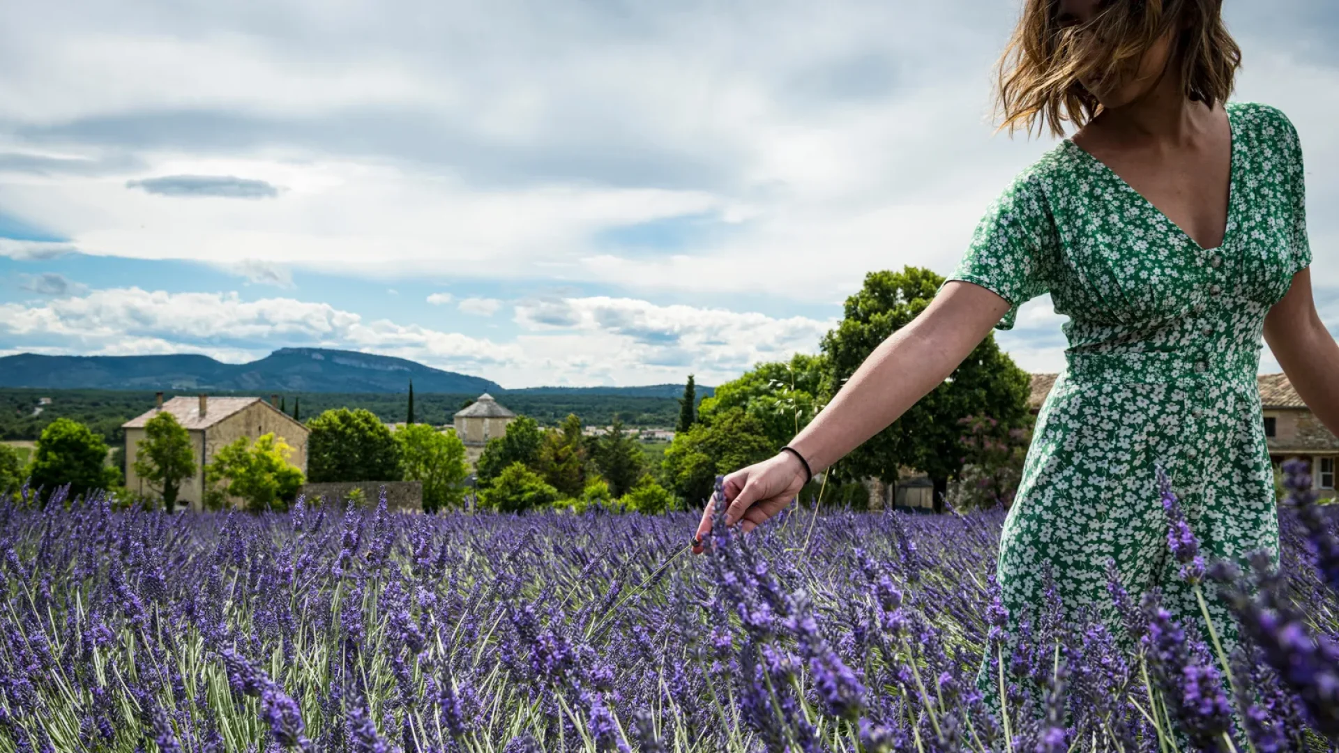 Woman touching lavender in Larnas