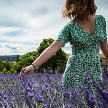 Woman touching lavender in Larnas
