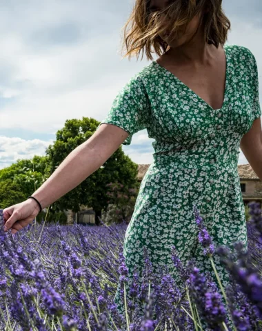 Woman touching lavender in Larnas