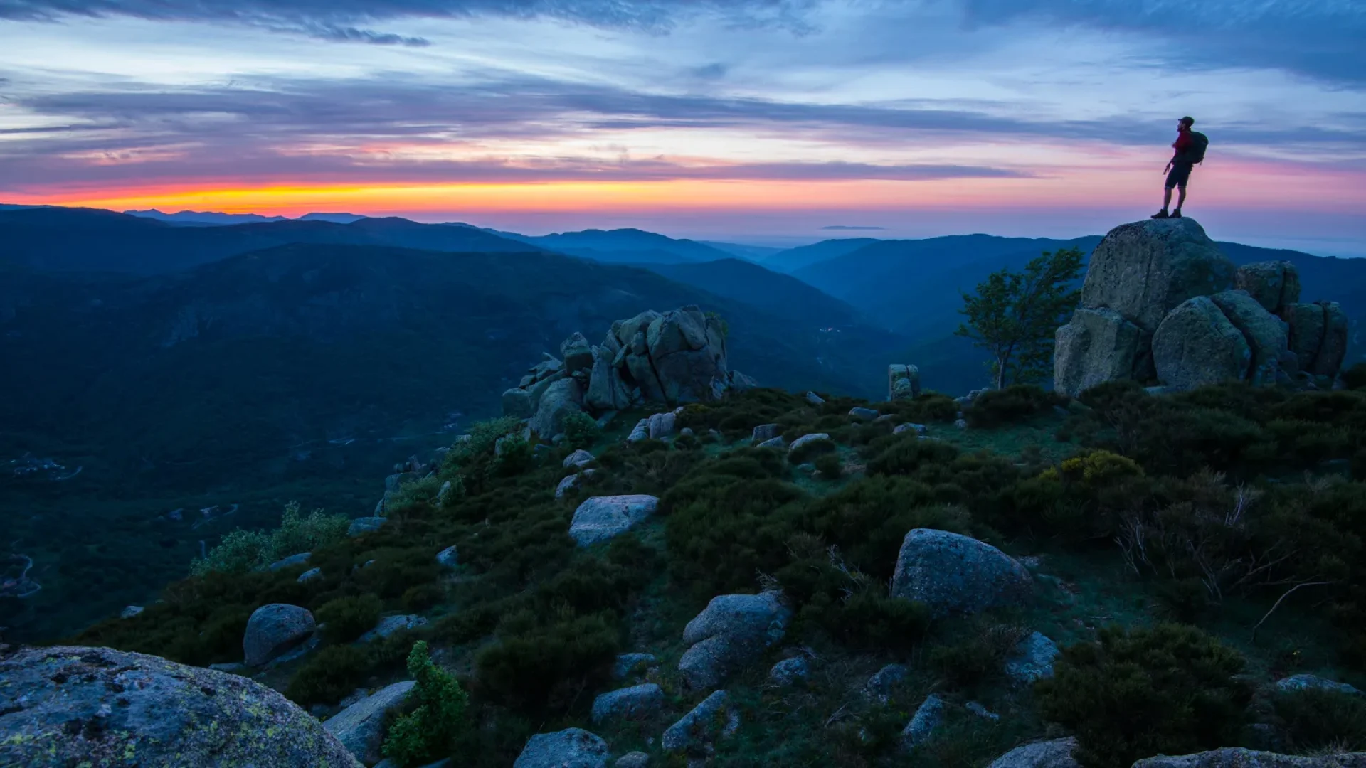 Man watching the sunset over the Montselgues mountains