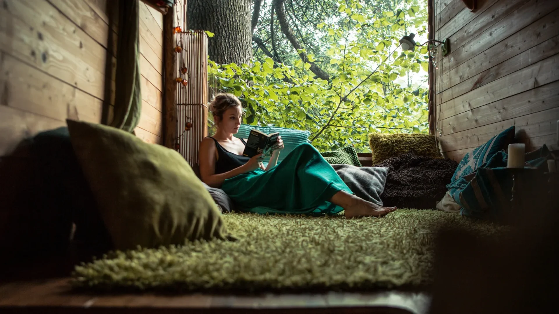 Woman reading in her accommodation