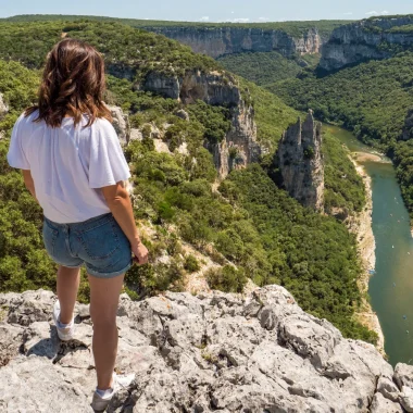 Woman observing the landscape of the Ardèche gorges, in summer, with the 