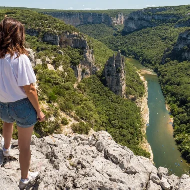 Woman observing the landscape of the Ardèche gorges, in summer, with the 