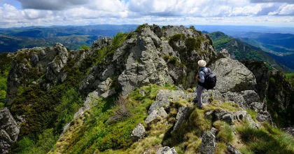 Hiker on the heights of the Tanargue, in spring