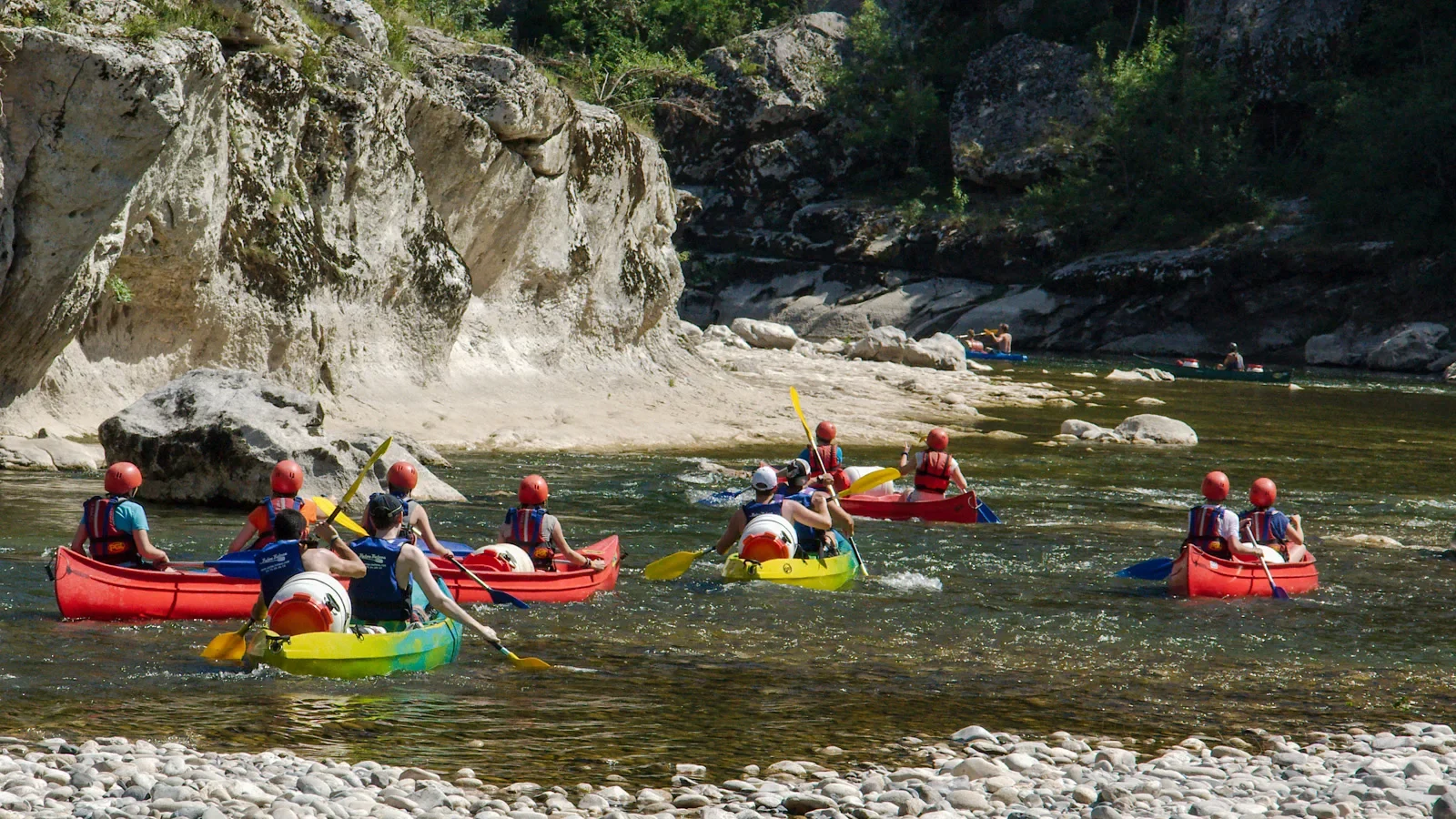 Group canoeing in the Ardèche Gorges in summer