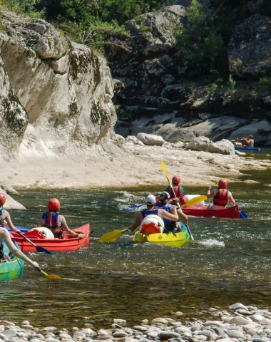 Group canoeing in the Ardèche Gorges in summer