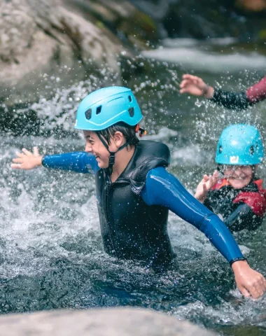 Family practicing canyoning