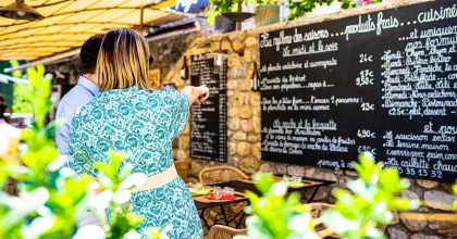 Couple at “Le Bec Figue” Bistrot de Pays, in the village with outstanding character of Labeaume, in summer
