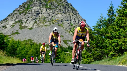 Ardéchoise cycling race passing in front of Mont Gerbier de Jonc, in summer