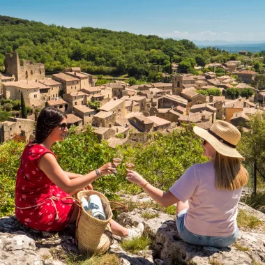 Wine tasting above the village with outstanding character of Saint-Montan, in summer